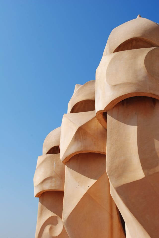 Some stature on the roof of a house in Barcelona