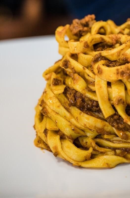 A plate full of tagliatelle with ragu