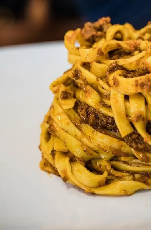 A plate full of tagliatelle with ragu