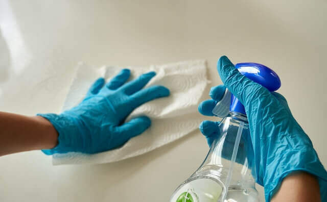 A person cleaning a surface