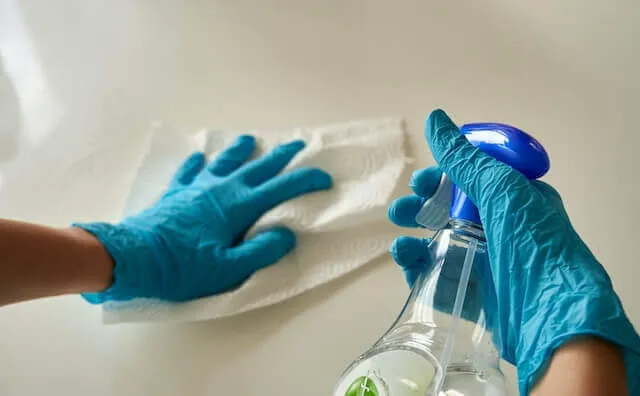 A person cleaning a surface