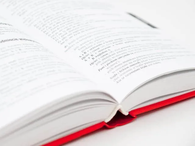 A student holding a schoolbook